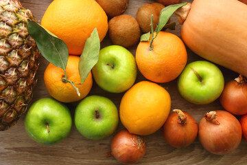 Various healthy fruit and vegetable on wooden background. Top view.