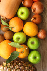 Various healthy fruit and vegetable on wooden background. Top view.