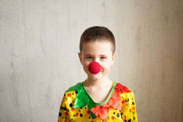 child clown with a red nose