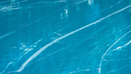 Turquoise color of mountain lake ice