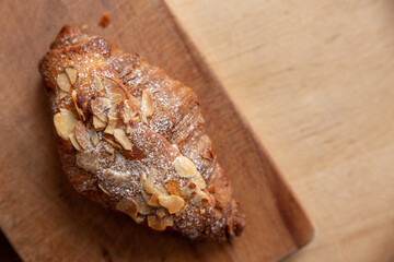 Almond croissant on a cutting board