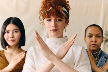Young white woman gesturing Break The Bias in support of International Women's Day with multi...