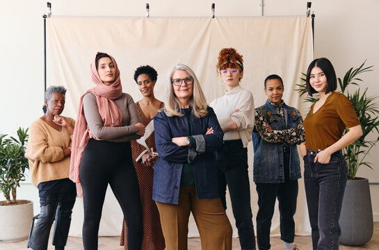 International Women's Day portrait of multi ethnic mixed age range women looking confidently towards camera