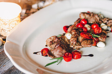Catering table set service at restaurant before party. Meat with cherry tomatoes