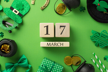 Top view photo of st patricks day decor wooden cubes calendar 17 march party glasses leprechaun hat straws green bow-tie giftbox horseshoe clovers pots gold coins on isolated pastel green background - Powered by Adobe