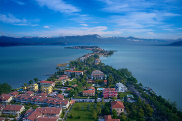 Drone view of Scaliger Castle of Sirmione at sunrise. Sirmione, Lake Garda, Italy aerial view. Sirmione on Lake Garda drone view. Sirmione at high altitude, Lake Garda, Italy.