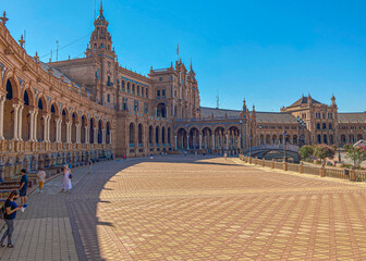 Fototapeta premium Seville, Spain: 03-07-2021: Seville Sevilla Plaza de Espana in Andalusia Spain square. is a square in the Parque de Maria Luisa, Historical landmark. Arabic ceramic style. 