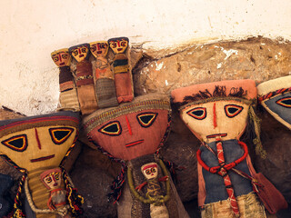 Ancient Prehispanic doll from Cusco, Peru made of old fabric on white background