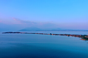 Drone view of Sirmione. Sirmione aerial view. Aerial panorama of the Sirmione peninsula. Sirmione on Lake Garda drone view. Panorama of Lake Garda. Sirmione, Lake Garda, Italy.