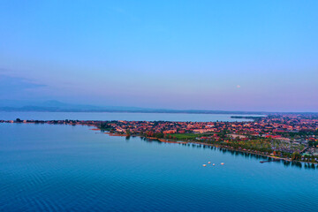 Sirmione on Lake Garda drone view. Panorama of Lake Garda. Sirmione, Lake Garda, Italy. Drone view of Sirmione. Sirmione aerial view. Aerial panorama of the Sirmione peninsula.