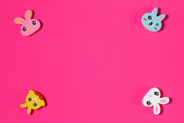 Pink background with four cute animals at the corners