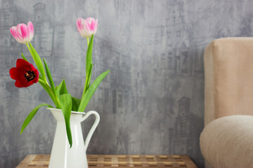 Bouquet tulips wooden table beige sofa bedroom