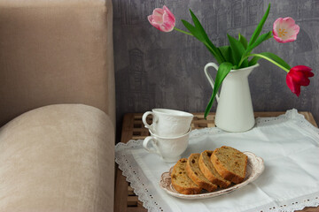 Lemon cake table bed jug bouquet tulips bedroom