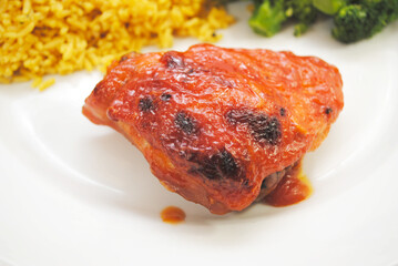 Close-Up of a Cooked Chicken Thigh with Catalina Dressing	Baked on Top