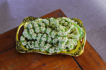 close up view of jasmine necklace that usually used in Sundanese Wedding tradition that worn by the bride's mother to the groom as a symbol of welcome to the family