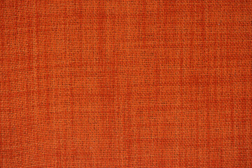 Fabric texture in ocher color. Cloth weave fabric for clothes and linen close-up. Fabric wallpaper background.