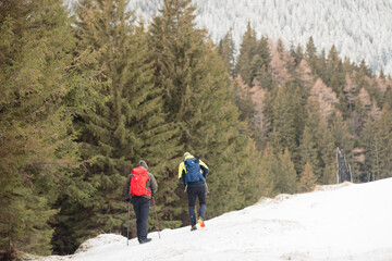 Mountaineers, hikers, and travelers can spend the day adventuring in the snowy mountains on a sunny winter day