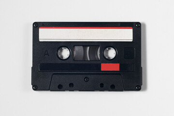 Vintage audio cassette isolated white background. red and white label. Use marks,