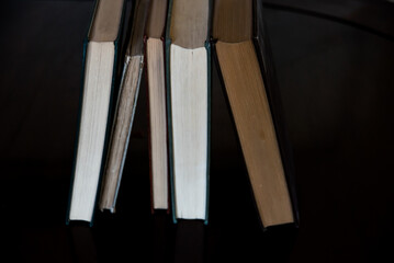 black and white books supported by each other