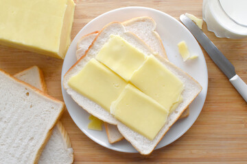 Cheese sandwich on a white plate.  Cheese on bread.  Flat lay top view food photography.  Food from above concept. 