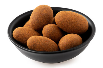 Cinnamon and chocolate coated almonds in a bowl isolated.
