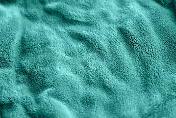 turquoise delicate soft background of fur plush smooth fabric. Texture of aquamarine soft fleecy...