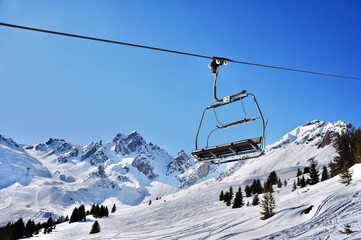 Fototapeta na wymiar Empty ski lift in the mountains