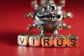 Strong angry virus with a face. The coronavirus is slightly blurred. A type of virus made of metal