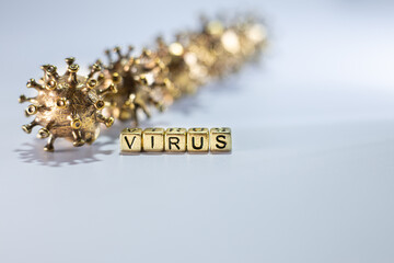Strong angry virus with a face. The coronavirus is slightly blurred. A type of virus made of metal
