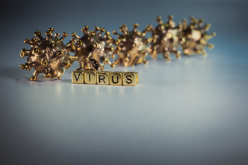 Strong angry virus with a face. The coronavirus is slightly blurred. A type of virus made of metal