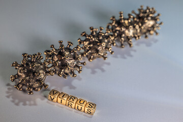 Strong angry virus with a face. The coronavirus is slightly blurred. A type of virus made of metal