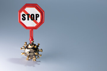 Strong angry virus with a face. The coronavirus is slightly blurred. A type of virus made of metal