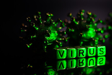 Strong angry virus with a face. The coronavirus is slightly blurred. A type of virus made of metal