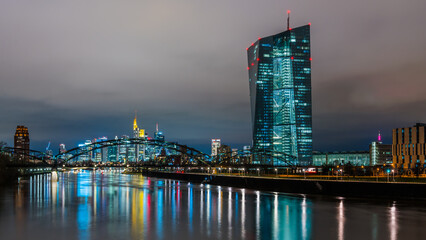 European Central Bank, ECB, at night in front of the illuminated skyline, Frankfurt am Main, Hesse, Germany - obrazy, fototapety, plakaty