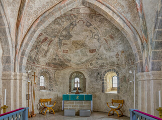 the Choir with a stone altar and a big mural depicting christ in Majesty, the pantocrator