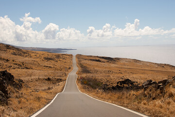 Long desert road with the end on the beach in Kaupo, Maui, Hawai.