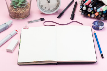 Set of colored alcohol based sketch drawing markers, accessories for drawing on pink, horizontal