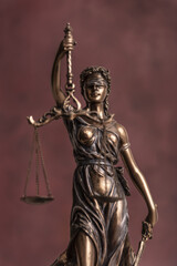 Law and judgment concept. Figure of Lady Justice in notary office close-up.
