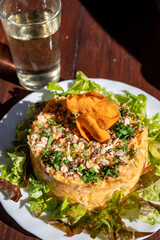 Dinner at guachinche, typical Canary Island establishment on Tenerife, where locally produced white or red wine served accompanied by homemade traditional food, sweet potato salad