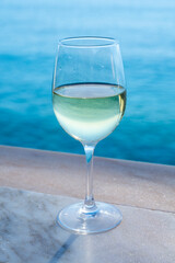 Drinking of white wine with view on blue Atlantic ocean on Tenerife, Canary islands, Spain