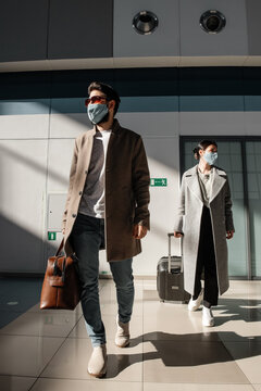 Travelers walking in airport during epidemic
