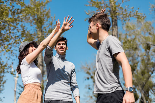 Young Friends High Fiving