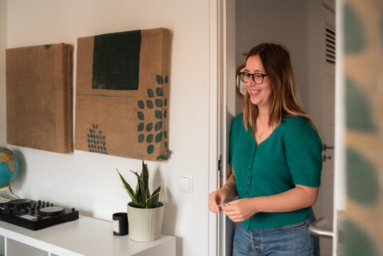 Woman talking standing in the doorway