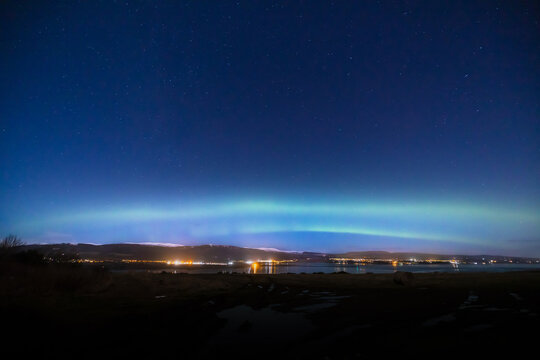 a view of the aurora borealis in the north west highlands of scotland during a clear spring night