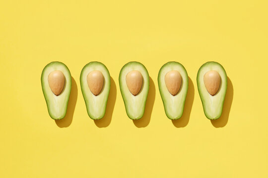 Ripe tasty avocado in row