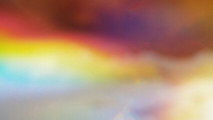 Abstract sky background with colorful light leak effect.