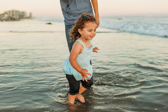 Young girl wading in ocean