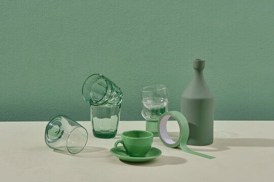 Green Decoration With Kitchenware And Glasses Tableware