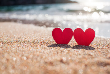 romantic symbol of two hearts on the beach
