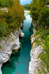 Naklejka na ściany i meble the crystalclear Water of River Soča cutes deep into Limestonerocks, Kobarid, Slovenia